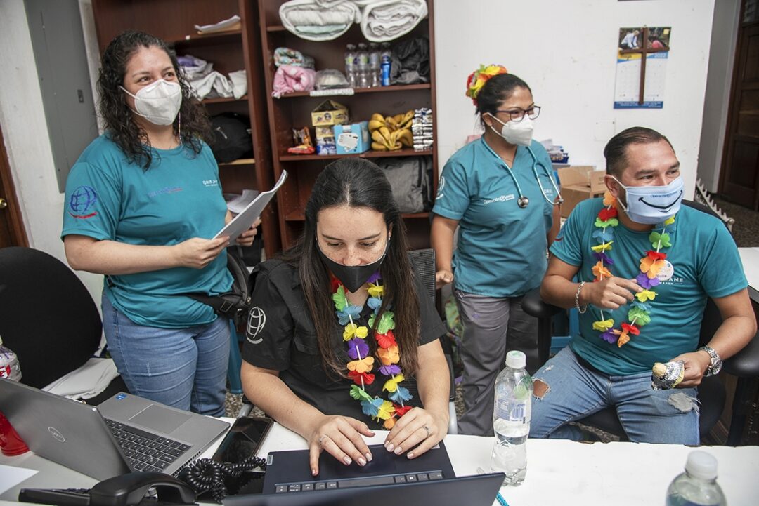 National registry coordinator Paola Arroyave, center, is surrounded by center coordinator Rosa Solares, left, pediatrician Dr. Alma Castaneda and nonmedical volunteer Guillermo Castaneda during a 2022 Operation Smile surgical program in Guatemala City. Photo: Rohanna Mertens.