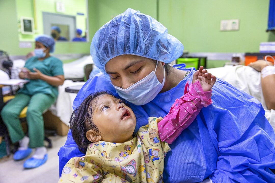 Leyda rests comfortably in her mother’s arms after receiving her long-awaited cleft surgery. Photo: Lorenzo Monacelli.