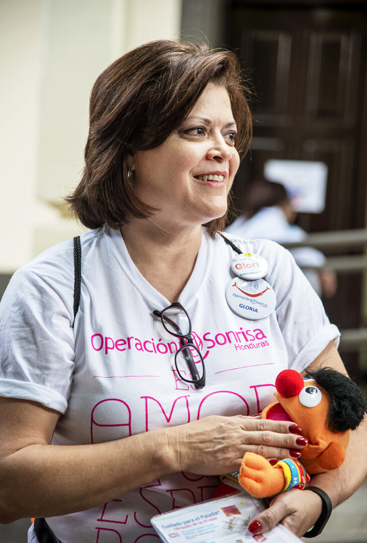 Gloria Vilches holds toys and supplies that she uses during her speech therapy sessions with Operation Smile patients.