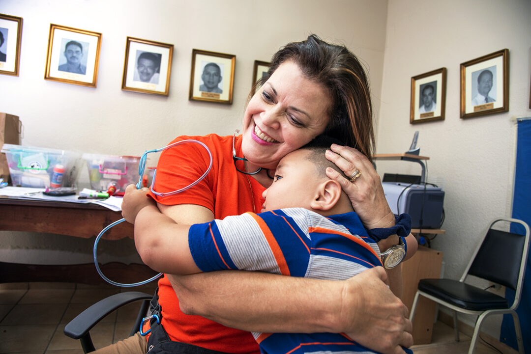 Gloria Vilches shares a hug with 5-year-old Josue during a 2017 Operation Smile Honduras surgical program at San Felipe Hospital in Tegucigalpa.